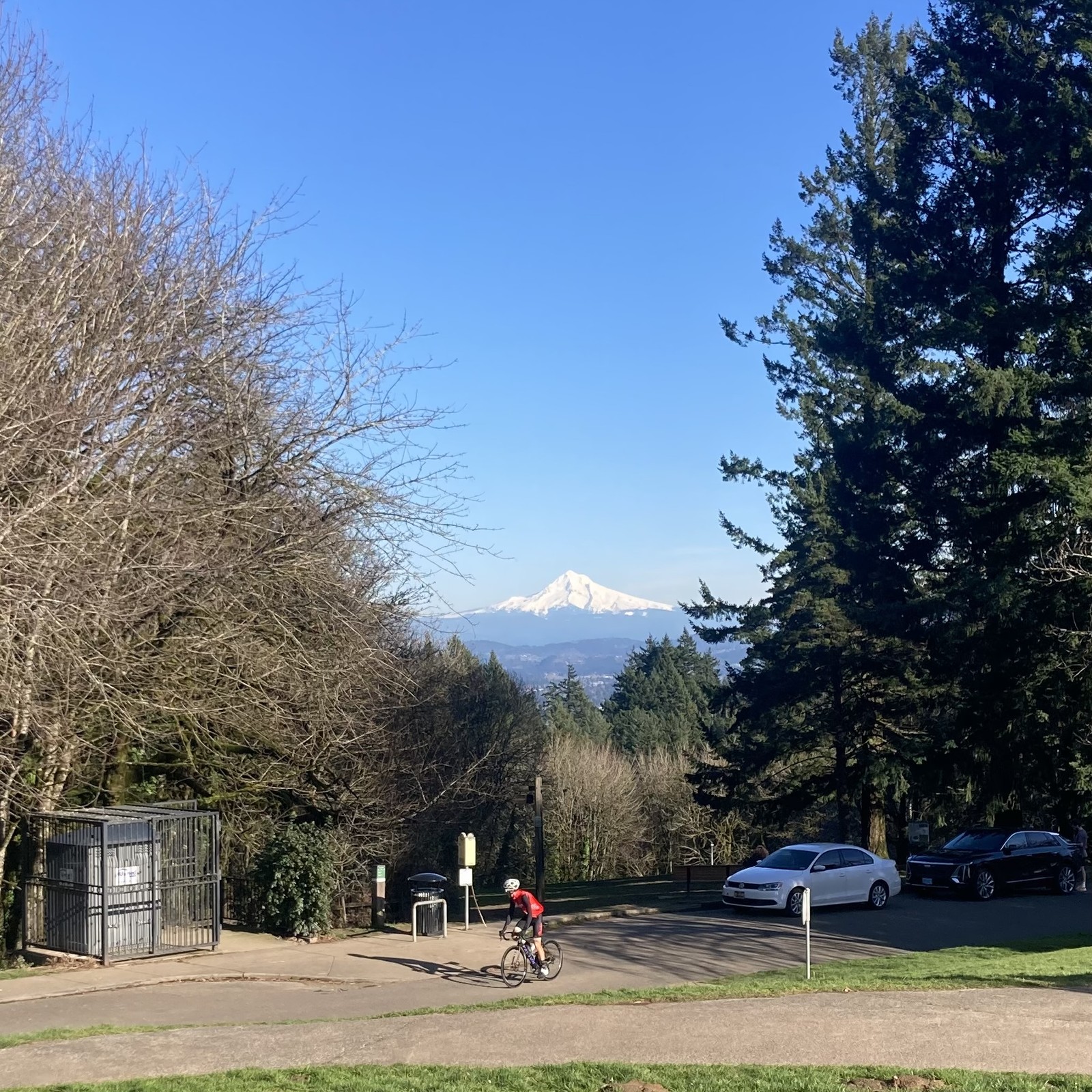 FINALLY outside again after like a month off. Snowy white mountain, brilliant blue sky, guy on bike about 100' away & slightly downhill from us